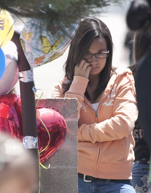Margaret Distler  |  The Salt Lake Tribune

Erinn Walker reflects on the afternoon of Thursday, June 9, 2011, near the memorial placed at the site where their friend, Shariah Casper, was hit by a train the previous day.