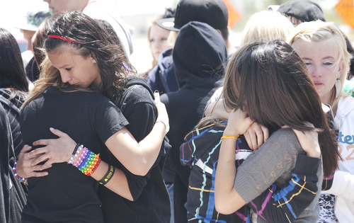 Margaret Distler  |  The Salt Lake Tribune

Allison Delgado (left, facing) grieves with a friend alongside Jessica Huth, Jenny Kandavong and Nicole Anthony on Thursday, June 9, 2011, near the memorial placed at the site where Shariah Casper was hit by a train the previous day.