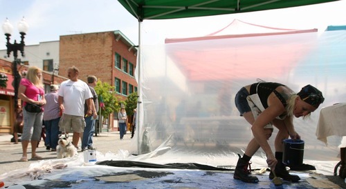 Leah Hogsten  |  The Salt Lake Tribune
Artist Nora Choquette of Ogden splashes paint on her intuitive painting at the 8th annual Ogden Arts Festival  at Ogden's Historic Union Station,  Saturday, June 11 2011 in Ogden . The free event featured works of more than 60 local and regional artists, live music, exhibits and art activities for kids.