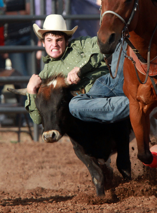 Rick Egan l The Salt Lake Tribune

Baxtor Roche, Bear RIver, competes in the steer wrestling competition at the Utah High School Rodeo Championship round in Heber City, Saturday, June 10, 2011.