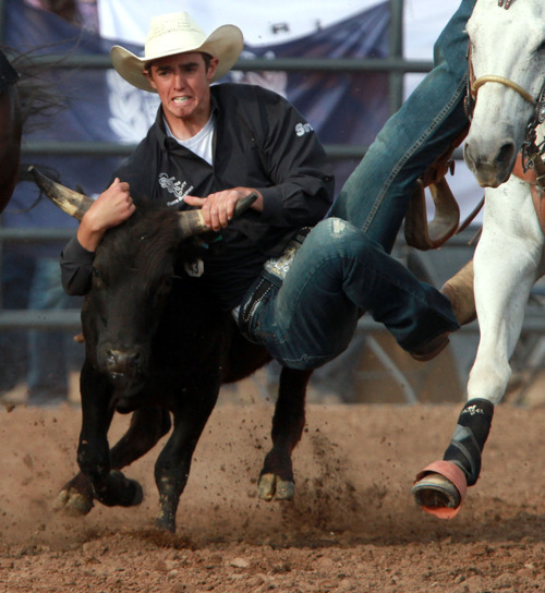 Rick Egan l The Salt Lake Tribune

Ryli Sutch, competes in the steer wrestling competition at the Utah High School Rodeo Championship round in Heber City, Saturday, June 10, 2011.
