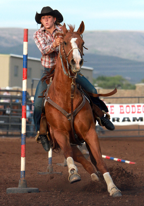 Rick Egan l The Salt Lake Tribune

 competes in the pole bending competition at the Utah High School Rodeo Championship round in Heber City, Saturday, June 10, 2011.