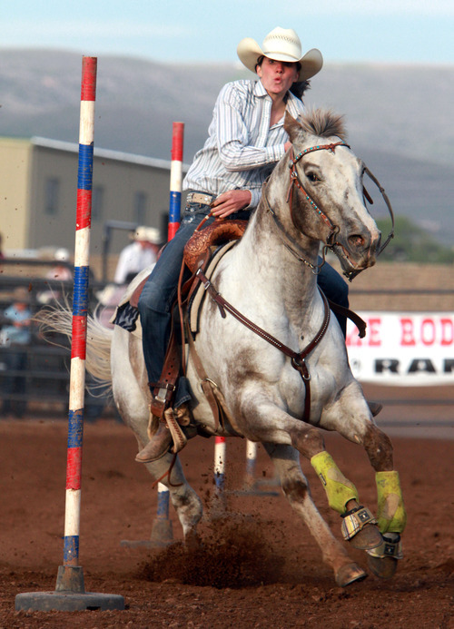 Rick Egan l The Salt Lake Tribune

Sammi Trapp, Lehi, competes in the pole bending competition at the Utah High School Rodeo Championship round in Heber City, Saturday, June 10, 2011.