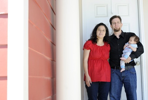 Sarah A. Miller  |  The Salt Lake Tribune

Lisa and Adam Schafer stand with their six-week-old son Michael in front of their Daybreak home in South Jordan Tuesday May 31, 2011. The family is struggling with unemployment, medical debt and possible foreclosure.