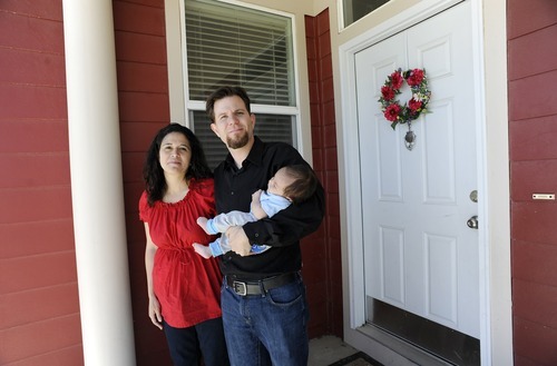 Sarah A. Miller  |  The Salt Lake Tribune

Lisa and Adam Schafer stand with their six-week-old son Michael in front of their Daybreak home in South Jordan Tuesday May 31, 2011. The family is struggling with unemployment, medical debt and possible foreclosure.