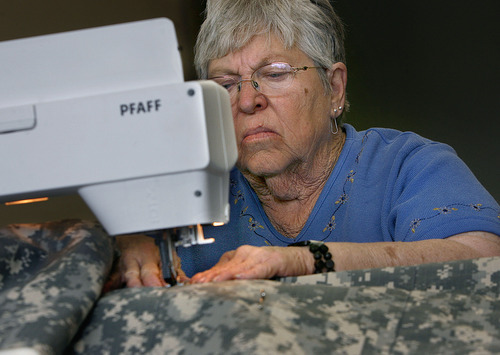 Scott Sommerdorf  |  The Salt Lake Tribune
Jan Larson of Central Valley works on sewing one of the quilts being made for the Utah National Guard's 222nd Field Artillery Unit at the 222nd Armory in Richfield on Monday.