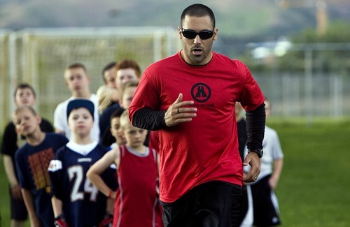 Djamila Grossman  |  The Salt Lake Tribune
NFL player Eric Weddle demonstrates a drill to a group of boys who attended the Eric Weddle Football Camp at Sunnyside Park in Salt Lake City.