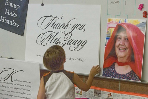 Paul Fraughton  |  The Salt Lake Tribune   A student looks at a giant thank you note Tuesday written to  kindergarten teacher Caolyn Zaugg at Salt Lake City's Hawthorne Elementary. Zaugg is retiring at the end of the school year  after 28 years  of teaching.
