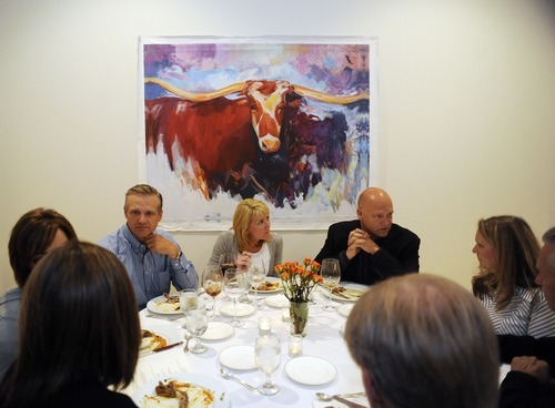 Sarah A. Miller  |  The Salt Lake Tribune
Diners enjoy a three-course meal under a painting by Park City artist Josee Nadeau during the By Invitation Only dinner held at the Maple Heights Condominium complex in Salt Lake City on May 28. By Invitation Only is an underground restaurant that takes place once a month in Salt Lake City and Park City. Owner Justin Kinnaird sets up a dinner at a different 