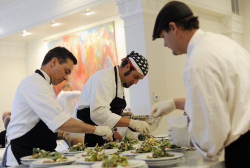 Sarah A. Miller  |  The Salt Lake Tribune
Chef Adam Kreisel, center, and assistants Mark Benson, left, and Brian Coburn prepare salads for the By Invitation Only dinner held at the Maple Heights Condominium complex in Salt Lake City on May 28. By Invitation Only is an underground restaurant that takes place once a month in Salt Lake City and Park City. Kinnaird sets up a dinner at a different 