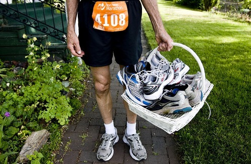 Djamila Grossman  |  The Salt Lake Tribune
Woody Whitlock has run marathons for several years. Now that he's 80 he decided to run eight marathons this year -- one for each decade of his life. He carries a basket with current and old running shoes at his Farmington home on Sunday.