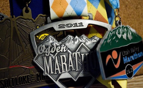 Djamila Grossman  |  The Salt Lake Tribune
Woody Whitlock has run marathons for several years. Now that he's 80 he decided to run eight marathons this year -- one for each decade of his life. Medals from marathons he's run are pinned to a board at his Farmington home.