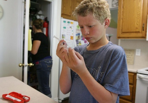 Leah Hogsten  |  The Salt Lake Tribune
Ethan Erickson, 11, inspects one of his insulin shots Friday in Taylorsville. Ethan will address Congress next week on behalf of the Juvenile Diabetes Research Foundation about efforts to increase funding for research into Type 1 diabetes.