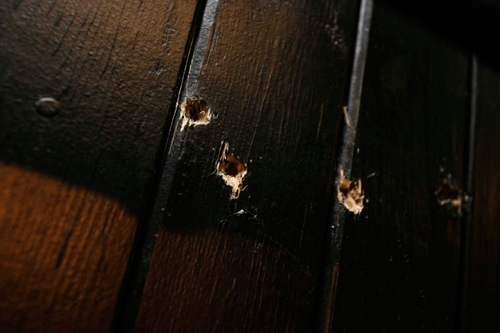 Trent Nelson  |  The Salt Lake Tribune
The execution chamber at the Utah State Prison after Ronnie Lee Gardner was executed by firing squad Friday, June 18, 2010. Four bullet holes are visible in the wood panel behind the chair. Gardner was convicted of aggravated murder, a capital felony, in 1985.