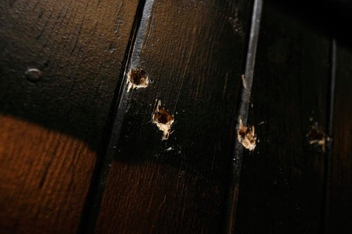 Trent Nelson  |  The Salt Lake Tribune
The execution chamber at the Utah State Prison after Ronnie Lee Gardner was executed by firing squad Friday, June 18, 2010. Four bullet holes are visible in the wood panel behind the chair. Gardner was convicted of aggravated murder, a capital felony, in 1985.