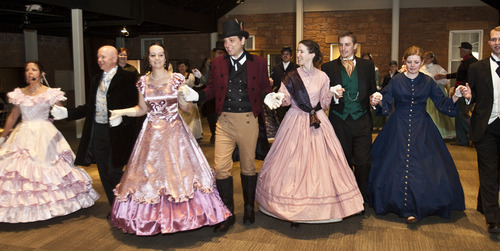 Chris Detrick  |  The Salt Lake Tribune 
Couples dance during a Civil War ball at the Fort Douglas Museum on Friday. Several dozen re-enacters and historical dancers swept across the floor, dancing reels and quadrilles, contras and country dances in the new addition to the Fort Douglas Museum on the University of Utah campus.