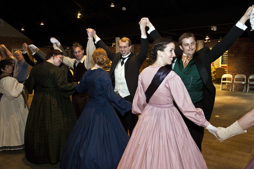 Chris Detrick  |  The Salt Lake Tribune 

Couples dance the Gothic dance during a Civil War ball at the Fort Douglas Museum on Friday. Several dozen re-enacters and historical dancers swept across the floor, dancing reels and quadrilles, contras and country dances in the new addition to the Fort Douglas Museum on the University of Utah campus.