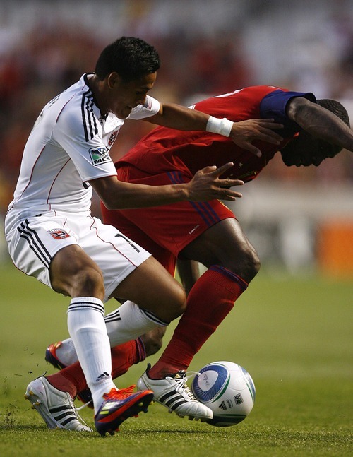 Djamila Grossman  |  The Salt Lake Tribune

Real Salt Lake plays D.C. United at Rio Tinto Stadium in Sandy, Utah, on Saturday, June 18, 2011.  RSL's Jean Alexandre (12) defends the ball against D.C.'s Andy Najar (14), in the second half of the game.