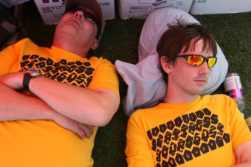 Leah Hogsten  |  The Salt Lake Tribune
Levoy Haight and son Derek Haight of West Jordan take a nap while waiting for their Eating Your Dust team members. Ragnar Relay Wasatch Back 2011 teams finish their 188-mile run at Park City High School Saturday, June 18 2011 in Park City. Teams race relay-style 200 miles overnight from Logan to Park City. Teams usually run for a variety of causes and often wear costumes.