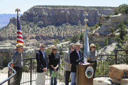 In this photo provided by the U.S. Department of the Interior, Interior Secretary Ken Salazar speaks at a news conference on the at Mather Point at the rim of the Grand Canyon in Arizona Monday, June 20, 2011. The Interior Department has extended a temporary ban on the filing of new mining claims near the Grand Canyon with an eye toward protecting 1 million acres (400,000 hectares) and giving the federal government more time to study the economic and environmental effects of mining. (AP Photo/U.S. Department of the Interior)