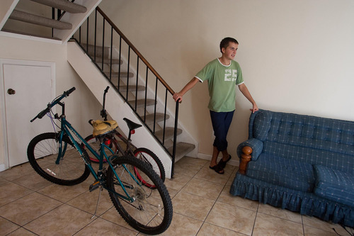 In this Wednesday, Sept, 1, 2010 file picture, Ievgen Kondzateko, an 18-year-old student from the Ukraine stands by his only form or transportration, bicycles he found in the garbage as he talks about how he ended up in Destin, FL on his J-1 visa. Kondzateko was promised a job as a lifeguard with a certain amount of hours per week by the company charging foreign students to come to the United States for summer work. Instead, the lifeguard job was not available and he was hardly able to make ends meet and lived in pauper conditions. The State Department is acknowledging that one of its most popular exchange programs leaves foreign college students vulnerable to exploitation. It's unclear if new regulations the agency is pushing will stop the abuses. The revised rules which take effect July 15, 2011 will shift more responsibility onto companies designated sponsors in the J-1 Summer Work Travel Program. (AP Photo/Mari Darr-Welch)