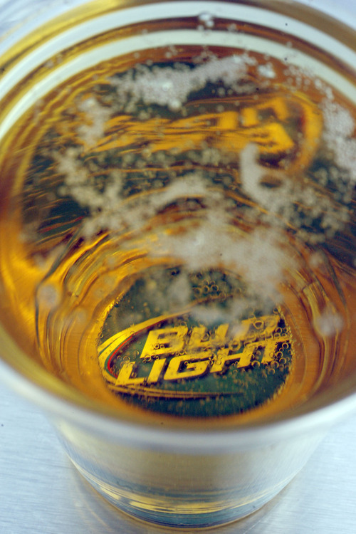 Francisco Kjolseth  |  The Salt Lake Tribune
Bud Light is advertised on a small disc magnet used in the Bottoms Up beer dispenser for events at stadiums and bars. It shoots beer into a cup from the bottom to pour a more efficient cup of beer. It produces no or very little head by using magnets at the bottom of the cup to close up the hole where a valve pokes through to fill it. One of the other big advantages is that it fills the cup faster with no waste of beer that you have to pour out to get rid of the head.