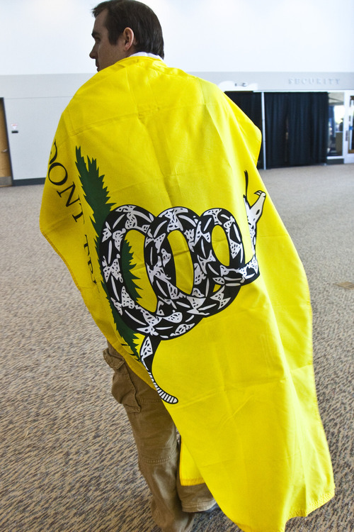Chris Detrick  |  The Salt Lake Tribune 
Von Fugal, of West Jordan, wears a Don't Tread on Me flag during the Utah State Republican Party Convention at the South Towne Expo Center on Saturday.