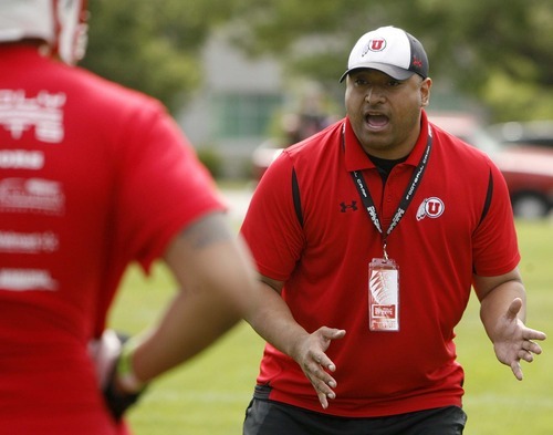 Trent Nelson  |  The Salt Lake Tribune
University of Utah assistant coach Kalani Sitake leads drills Thursday at the All-Poly football camp, held at Millcreek Junior High School.