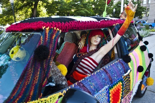 Photo by Chris Detrick | The Salt Lake Tribune 
Volunteers with Blazing Needles knit around Jocelyn Kearl's Mini Cooper for the Utah Arts Festival at Washington Square Tuesday June 21, 2011.  Over fifty people have been knitting an estimated 20,000 yards of yarn for the past three months for this project.