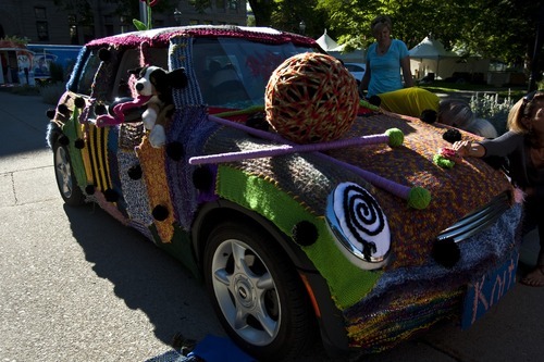 Photo by Chris Detrick | The Salt Lake Tribune 
Volunteers with Blazing Needles knit around Jocelyn Kearl's Mini Cooper for the Utah Arts Festival at Washington Square Tuesday June 21, 2011.  Over fifty people have been knitting an estimated 20,000 yards of yarn for the past three months for this project.
