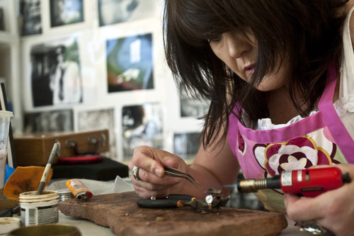 Chris Detrick | The Salt Lake Tribune 
Artist Christine Fedor, of Punkenstein Jewelry, works at making a ring in her studio Wednesday, June 15, 2011.