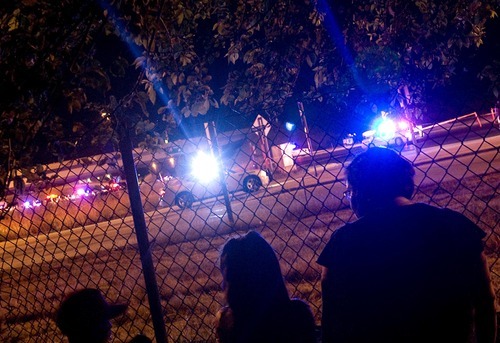 Djamila Grossman  |  The Salt Lake Tribune

Alejandra Ramos and her daughter Fernanda Granillo watch as police cars are lined up after an officer-involved shooting at the intersection of 3500 South and Interstate-215 in West Valley City on Friday.