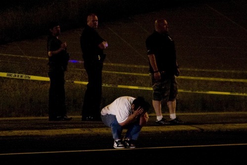 Margaret Distler  |  The Salt Lake Tribune

The sister of a suspect in an officer-involved shooting reacts at the scene of the incident at the intersection of 3500 South and Interstate-215 in Salt Lake City, Utah, on Friday, June 24, 2011. Two West Valley Police officers were struck in the shooting. The suspect died.