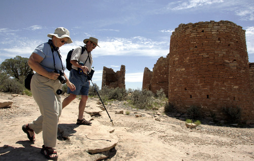 Tribune file photo
Visitors tour the ruins at Hovenweep National Monument.