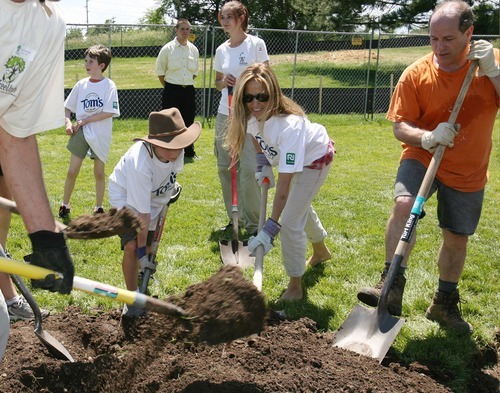 Steve Griffin  |  The Salt Lake Tribune

Pop star Sheryl Crow joins Tree Utah and Tom's of Maine volunteers as they plant trees in Sugarhouse Park in Salt Lake City on Friday, June 24, 2011.