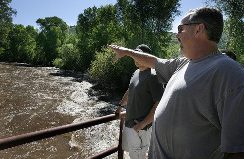 Scott Sommerdorf  |  The Salt Lake Tribune
John Ward, a Salt Lake City resident who has property higher in Weber Canyon, stopped with his sons, Riley and Jordan, to watch the raging Weber River near the mouth of Weber Canyon on .