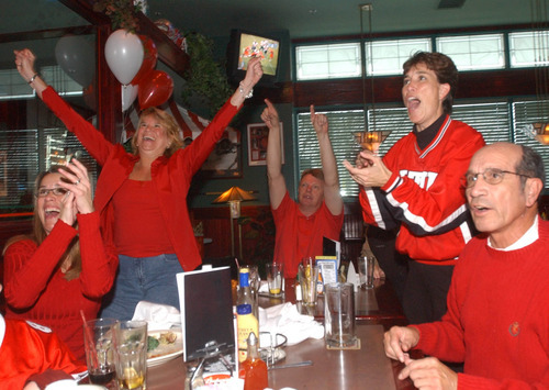 Ute fans watch a football game at Iggy's sports bar in this 2003 Tribune file photo.