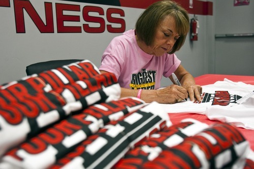 Chris Detrick | The Salt Lake Tribune 
Denise Hill signs shirts for fans at Four Pillar Fitness in Bountiful on Saturday, June 11, 2011.  Hill won 