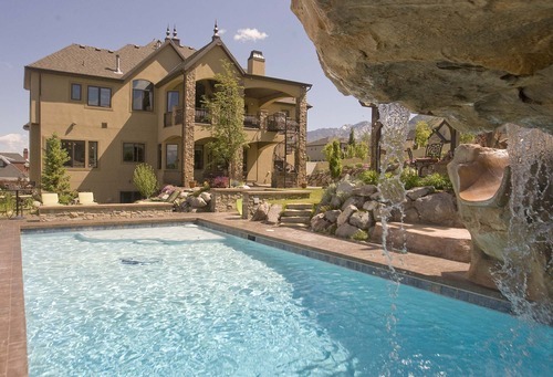 Paul Fraughton  |  The Salt Lake Tribune
The backyard of a home in Draper selling for more than $1 million, features swimming pool with waterfall and a grotto.