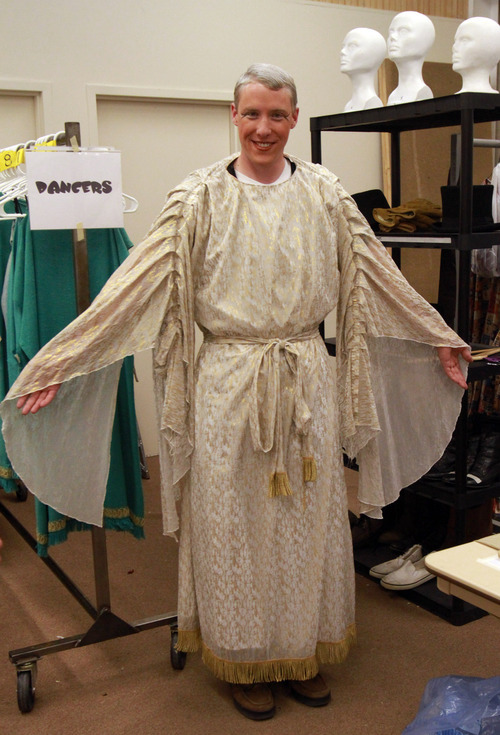 Rick Egan   |  The Salt Lake Tribune

John Pipes gets tries on his costume, for his part as Angel Moroni, for the dress rehearsal for the Mormon Miracle Pageant, Tuesday, June 14, 2011.