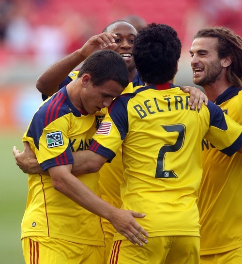 Steve Griffin  |  The Salt Lake Tribune

Real Salt Lake's Tony Beltran, center, is congratulated by his teammates after scoring the first goal of the game during first half action in the Real Salt Lake versus Wilmington soccer match at Rio Tinto Stadium in Sandy, Utah Tuesday, June 28, 2011.