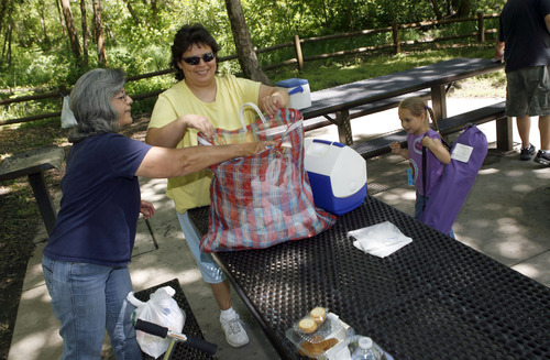 Francisco Kjolseth  |  The Salt Lake Tribune
Sherry Maestas packs up a picnic with her daughter-in-law Isabel Maestas after enjoying the outdoors up Mill Creek on Tuesday, June 21, 2011. 