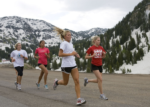 Al Hartmann  |  The Salt Lake Tribune
Members of the Alta High School cross country team take a high-altitude training run near Alta at the top of Little Cottonwood Canyon on Wednesday. The high country snowpack has lasted farther into the summer than usual.