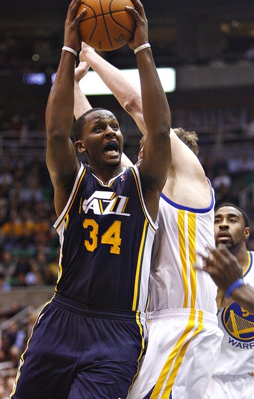 Djamila Grossman  |  The Salt Lake Tribune

The Utah Jazz's C.J. Miles (34) jumps up to score during a game against the Golden State Warriorsin Salt Lake City on Wednesday, Feb.16, 2011. The Jazz lost the game.