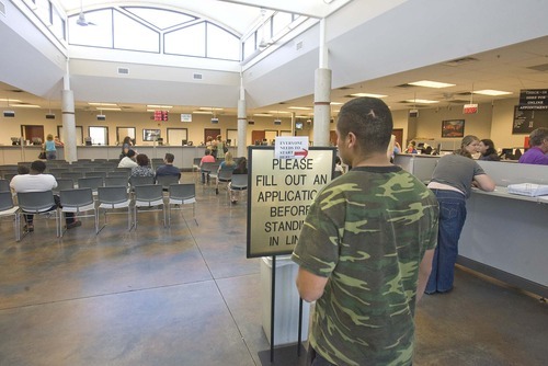 Paul Fraughton  |  The Salt Lake Tribune
An undocumented resident waits at the Driver License office in West Valley City to apply for a driving privilege card. He asked not to be identified in a photo.
