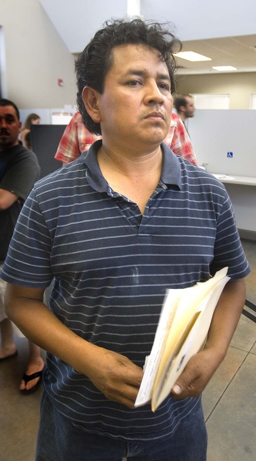 PAUL FRAUGHTON  |  The Salt Lake Tribune
Alfonso Gonzales waits in line at the Driver License Office in West Valley City to get a driving privilege card. Rules for the permits for undocumented drivers changes Friday, requiring fingerprints and adding additional fees.