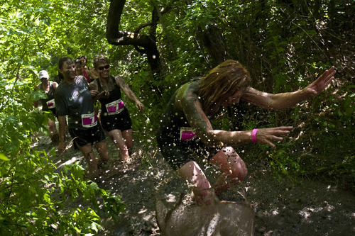 Photo by Chris Detrick | The Salt Lake Tribune 
Women participate in the Kiss Me Dirty Race Series at Wheeler Historic Farm Saturday July 2, 2011.  The four-mile obstacle mud course, was run only by women, who were raising money for gynecological cancer research.