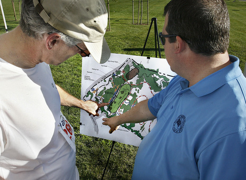 Scott Sommerdorf  |  The Salt Lake Tribune
Ken Leethan, right, Community and Economic Development Director for North Salt Lake discusses a map of the properties affected by the landslide with runner Daren Shaw on Saturday. North Salt Lake, Bountiful and Woods Cross raised funds through a breakfast and 5K walk/run to help victims of a slow-moving landslide in the Springhill neighborhood.