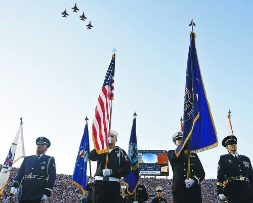 Djamila Grossman  |  The Salt Lake Tribune
The BYU Color Guard stands as planes fly overhead during the Stadium of Fire event in honor of the Fourth of July at Lavell Edwards Stadium in Provo, Utah, on Saturday.