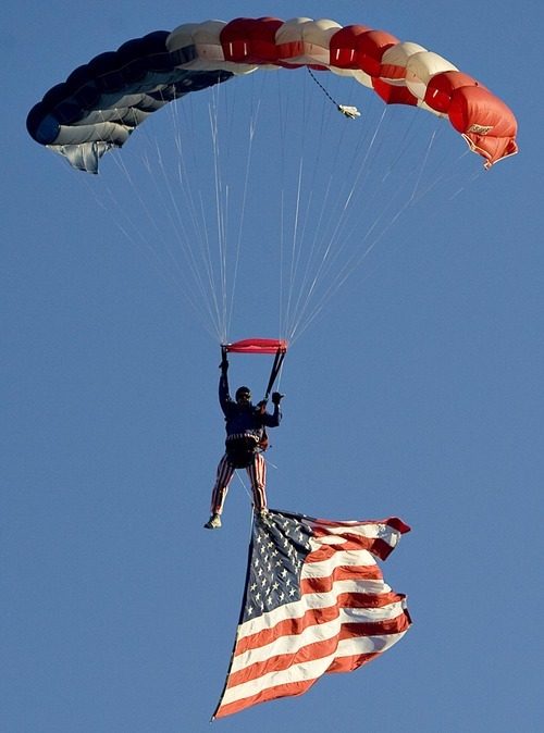 Djamila Grossman  |  The Salt Lake Tribune

A sky diver flies into the Stadium of Fire during the Freedom Festival at Provo in honor of the Fourth of July at LaVell Edwards Stadium in Provo, Utah, on Saturday, July 2, 2011.